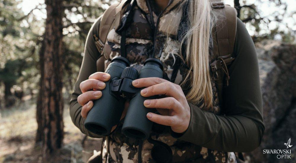 person holding binoculars