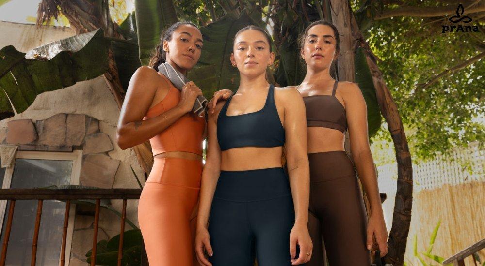 Three women in different styles of prAna sports bras