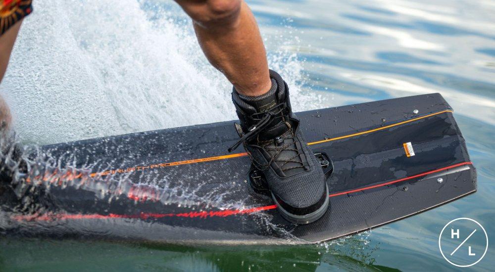 closeup of person wearing wakeboard boots and wakeboarding