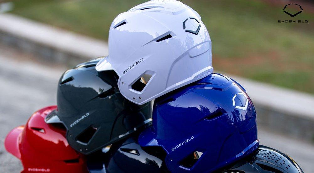 a pyramid of evoshield baseball helmets