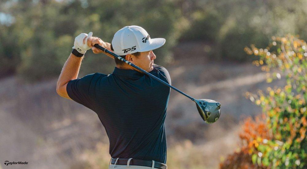A man swings a Taylormade golf club