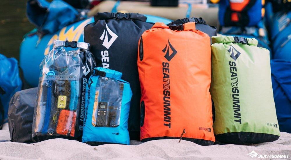 a group of sea to summit storage bags for sleeping bags and camping gear