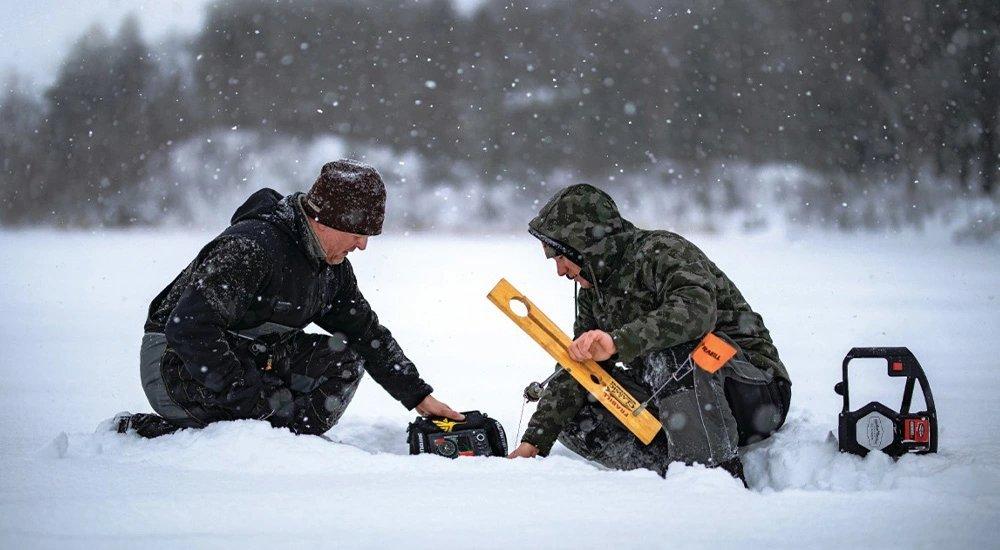 ice fishermen setting up their tip ups