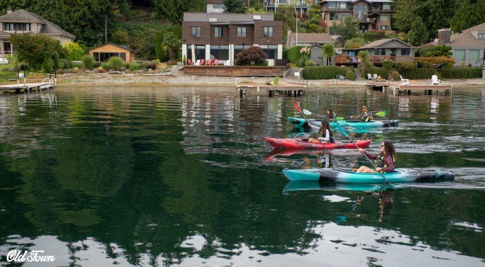 multiple people kayaking in the water