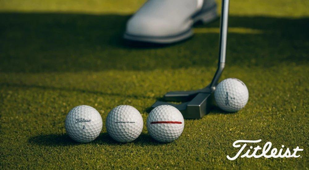 Titleist golf balls in a row on the course