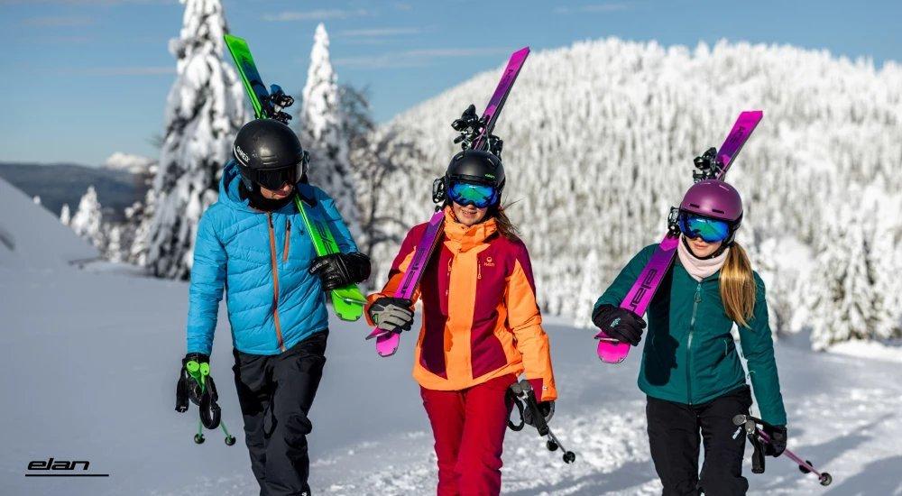 teens going up a mountain with their skis and ski poles