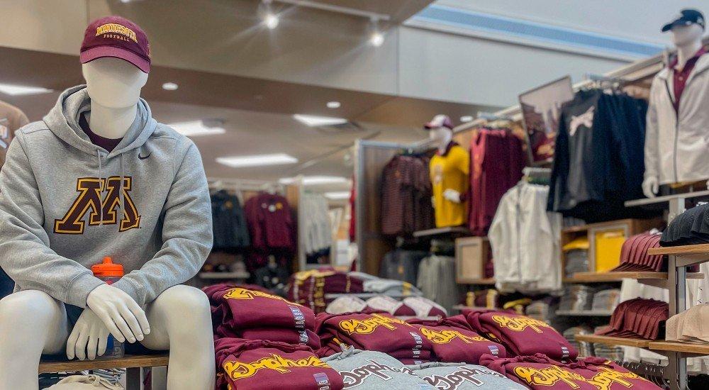 a selection of Minnesota Gophers clothing on display at Eden Prairie SCHEELS