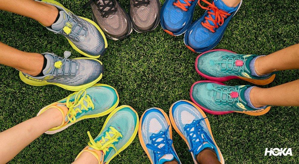 kids putting their running shoes in a circle