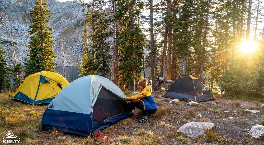 A group of Kelty tents at a backcountry campsite