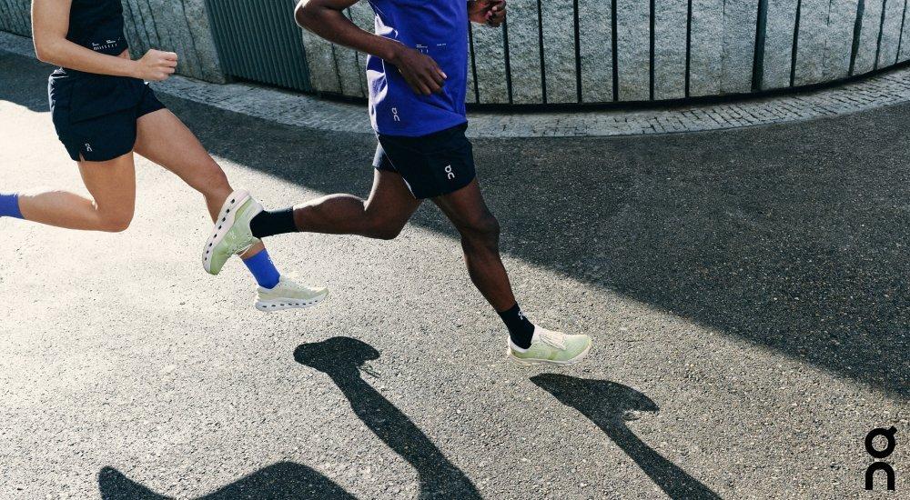 Two runners in On running shoes