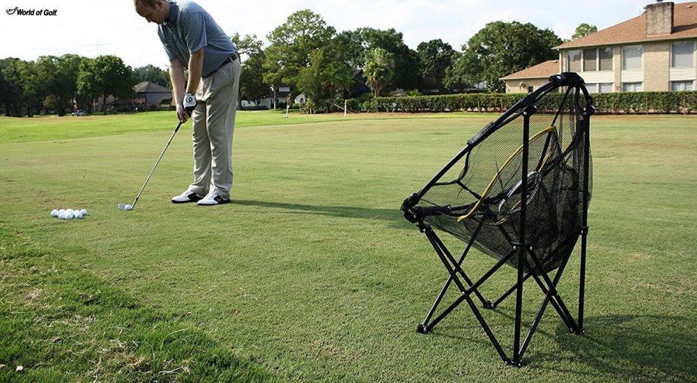 A golfer practicing with a chipping net