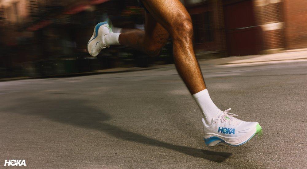A person running in Hoka shoes