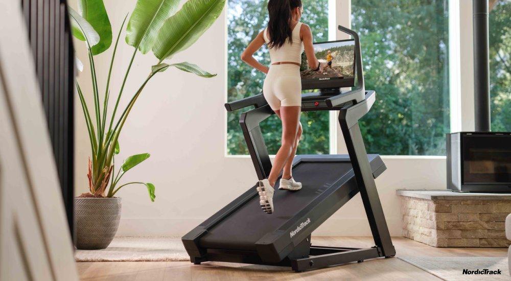 A woman on a NordicTrack treadmill