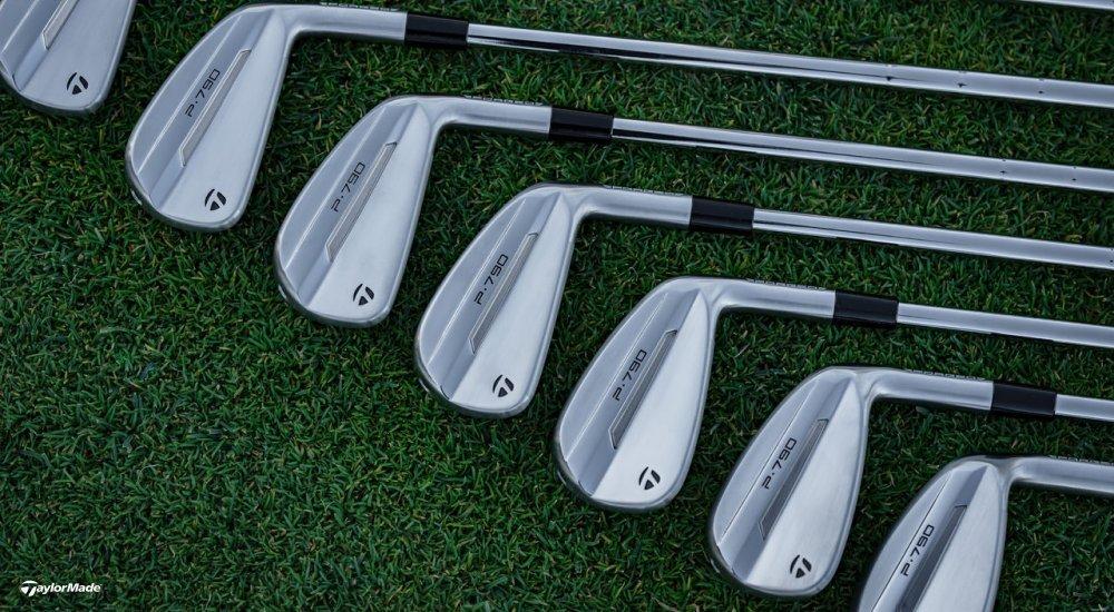 A lineup of TaylorMade golf clubs in the grass