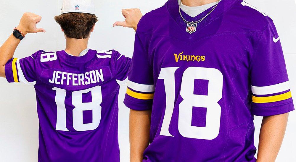 a girl posing in a vikings jersey
