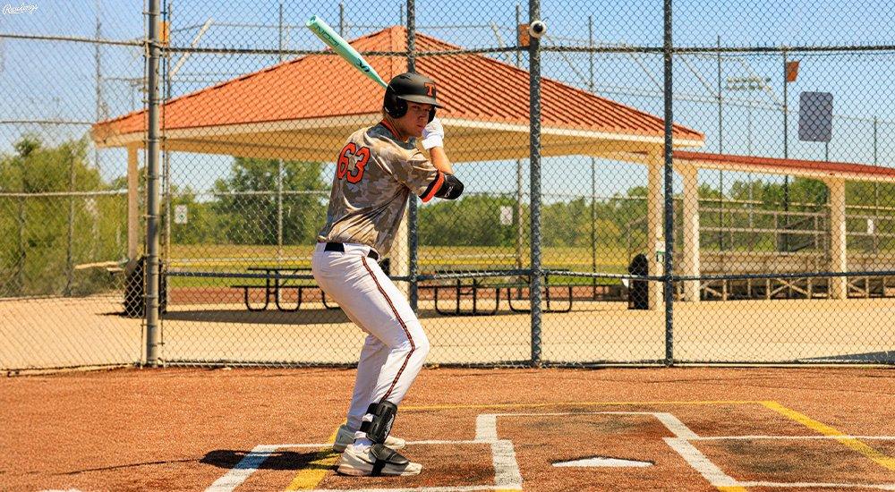A player getting ready to swing a BBCOR bat