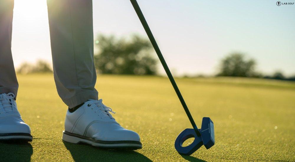 a golfer using a L.A.B. putter on the green