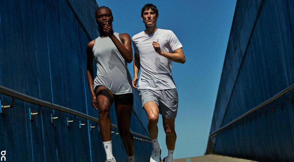 two people out running in the summer in on running apparel