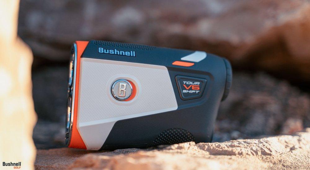 a bushnell golf rangefinder sitting on the golf course