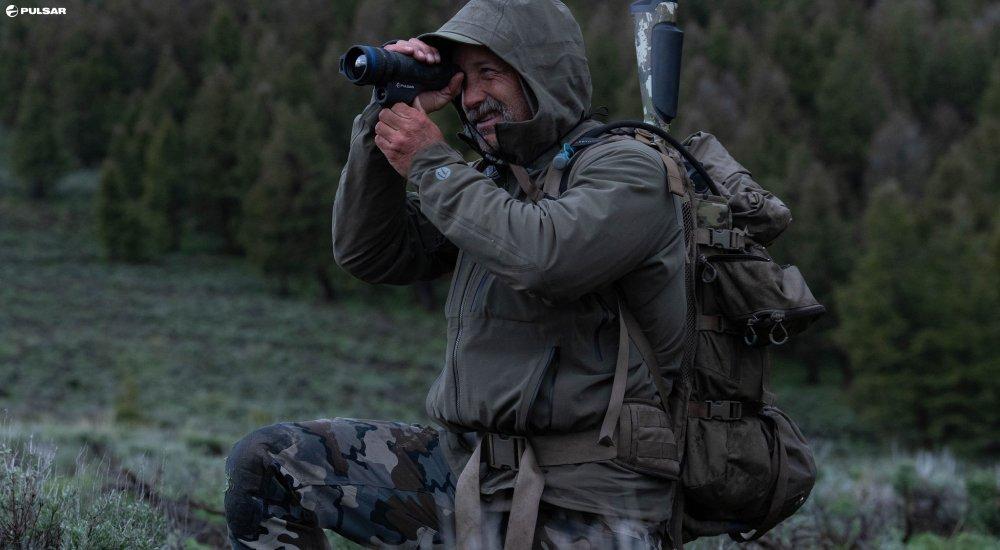 a person using a thermal optic when hunting at night