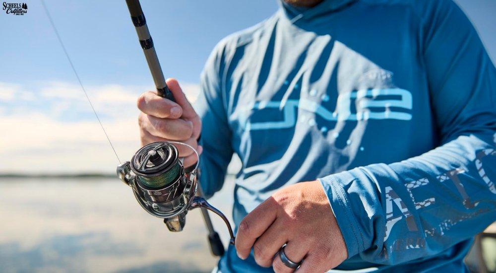a man using a spinning reel when open water fishing
