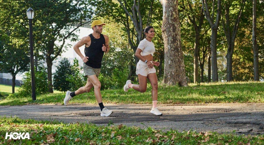 two people running in the park