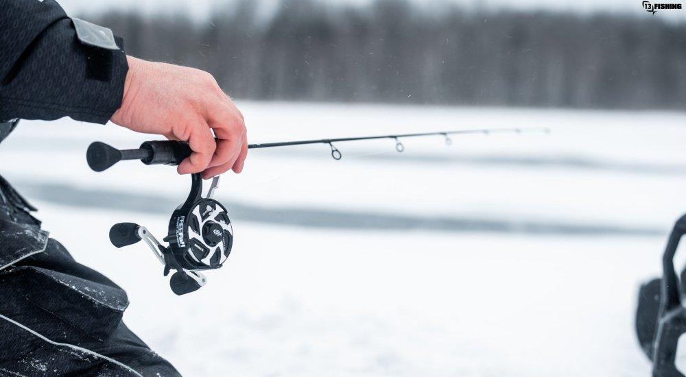 a man setting up his ice fishing rod