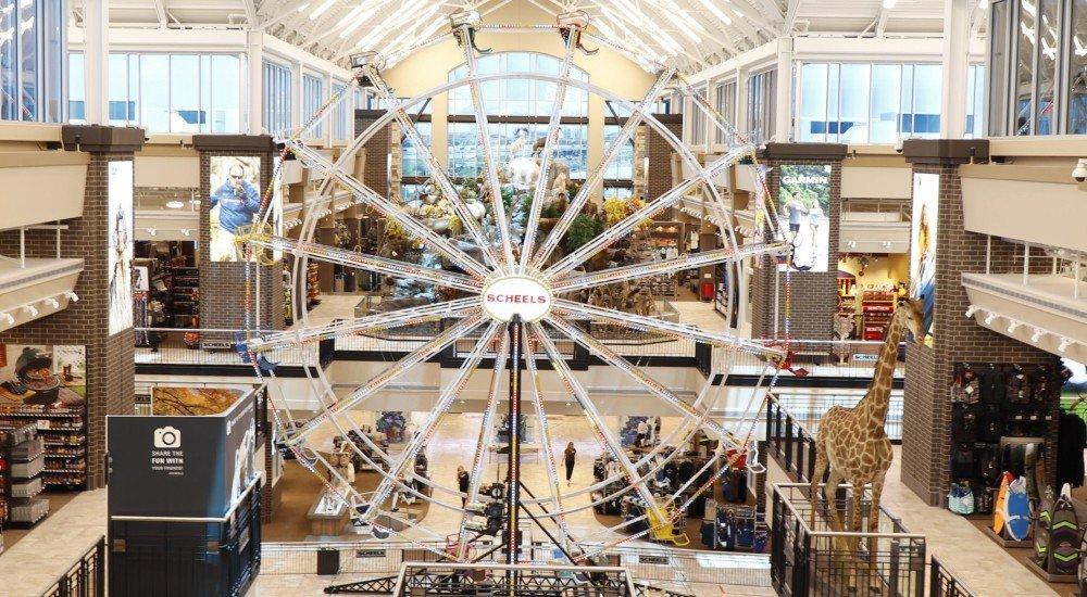 A Scheels store interior with a ferris wheel