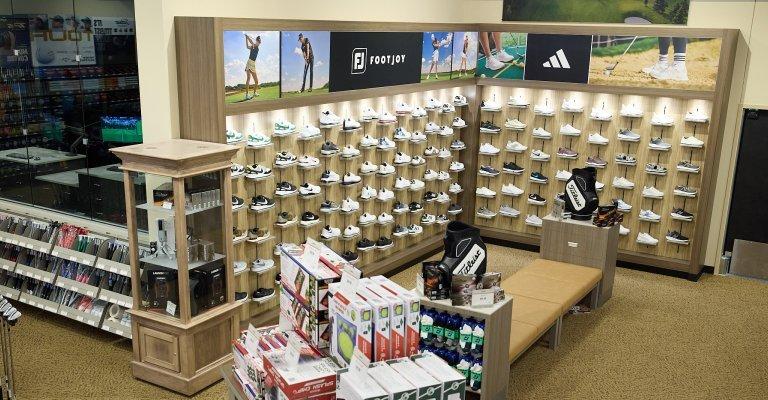 a wall of golf shoes at tulsa scheels