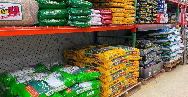 Shelves with grass seed and other lawn care