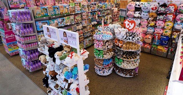 a variety of plush animals on display at SCHEELS