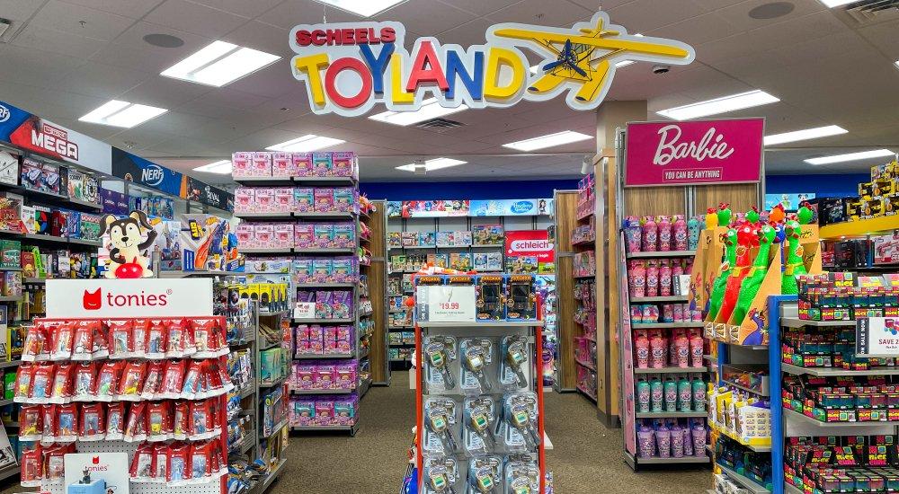 the toyland sign hanging in the SCHEELS toy shop 
