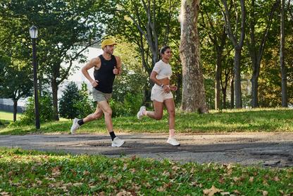 Mand and woman running in Hoka shoes
