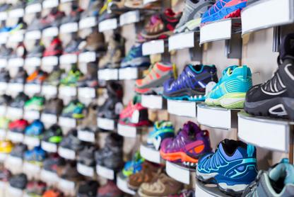 Wall of running shoes at a store