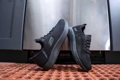 Skechers work shoes on a restaurant kitchen floor