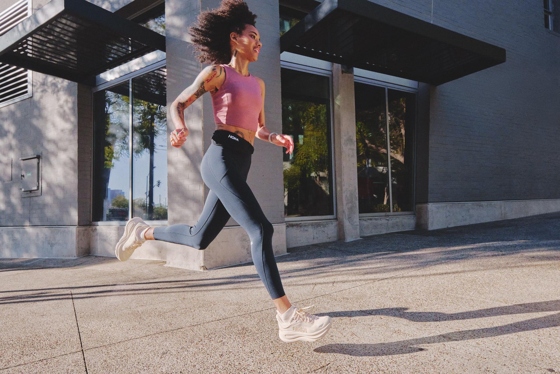 Woman running in Hoka Bondi 9 Shoes