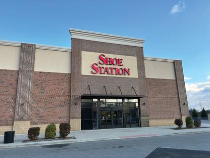 Shoe Station Store front with a clear blue sky behind it