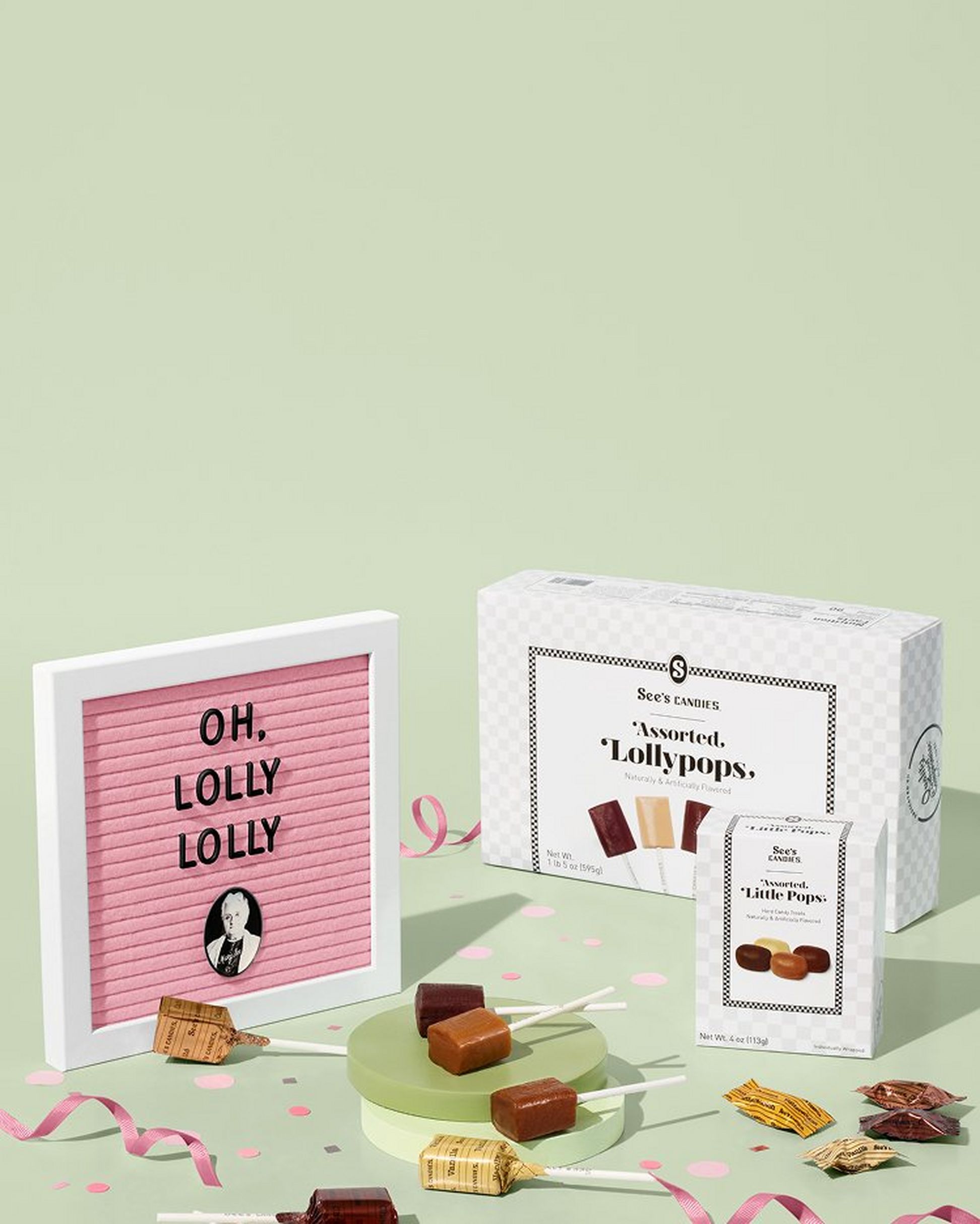 Frame that reads "Oh, Lolly Lolly" with a box of lollypops and a pastel green background