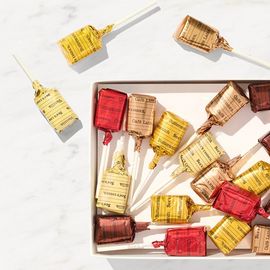 A box filled with a variety of lollypops