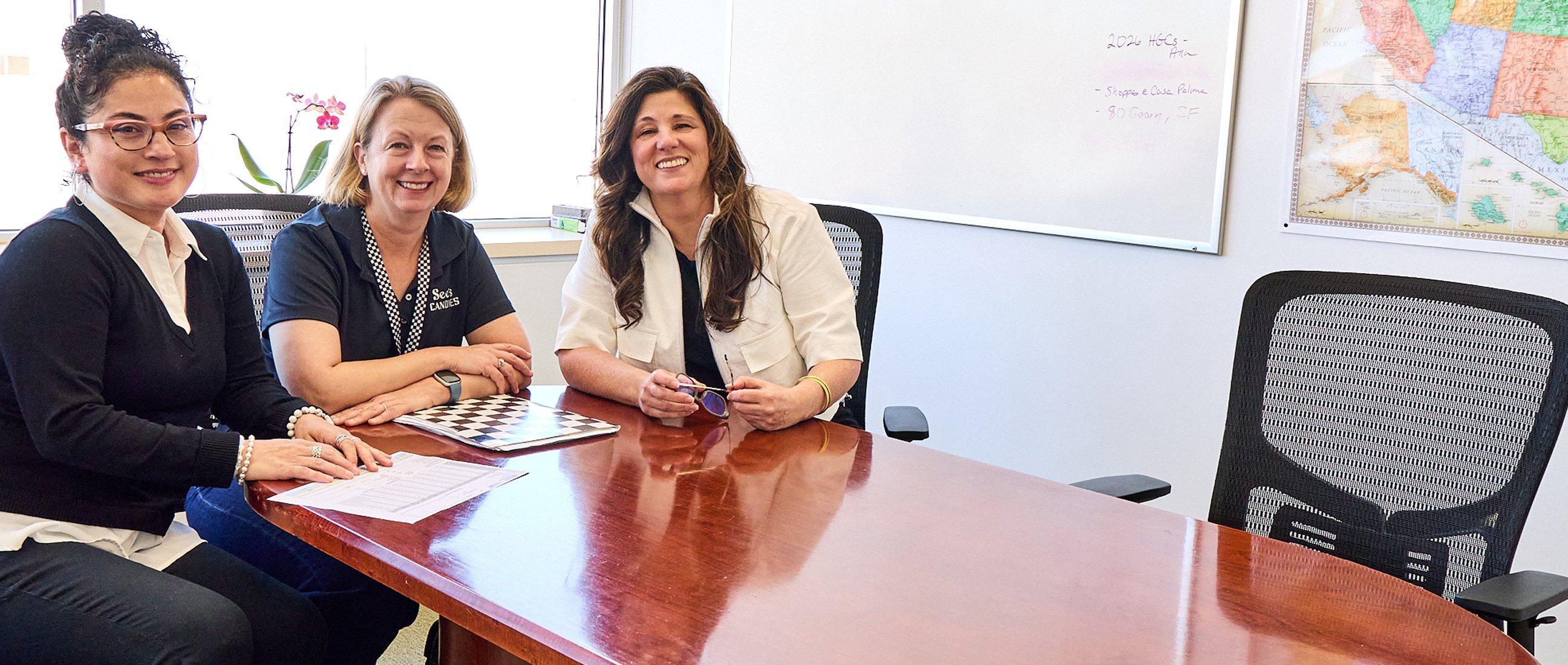See's employees gathered at a desk