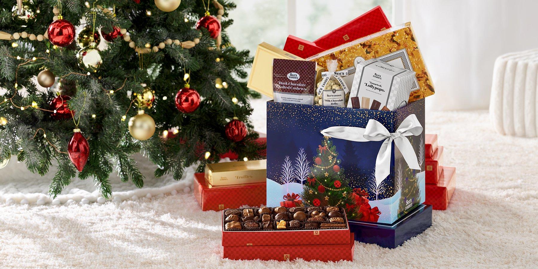 Christmas setting with a close up of See's Candies Gift Pack