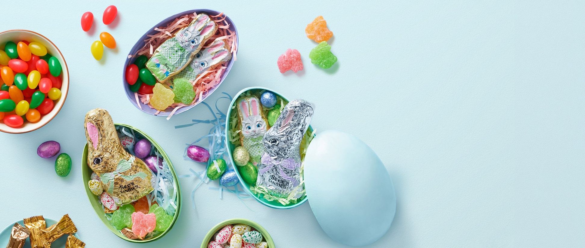 Easter egg stuffers featuring foiled bunnies, jelly beans, and sour bunnies