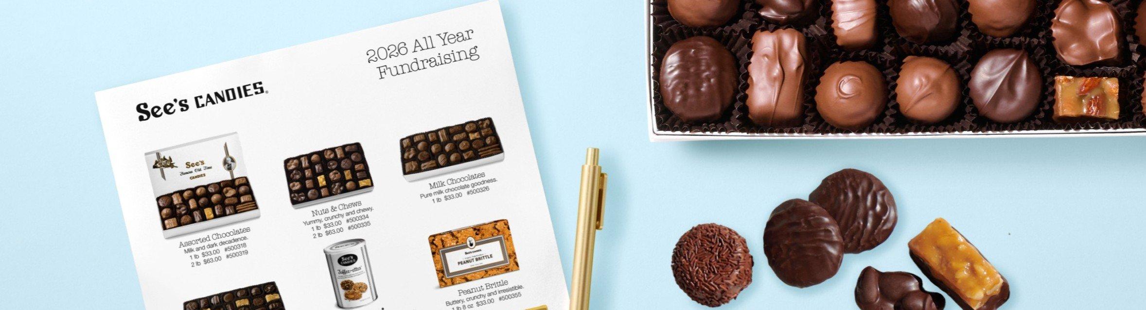 A fundraising order form next to a box of chocolates
