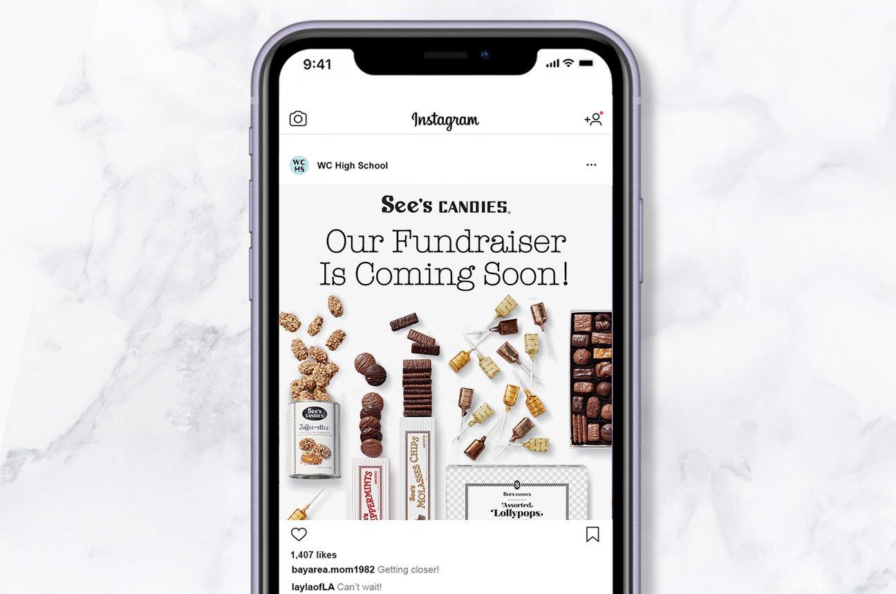 A cellphone showing a social media post with See's Candies that reads "Our fundraiser is coming soon!"
