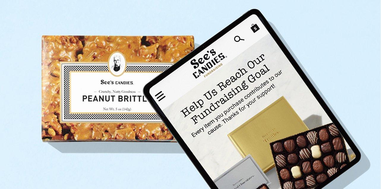 A tablet featuring the Yumraising website with a box of Peanut Brittle