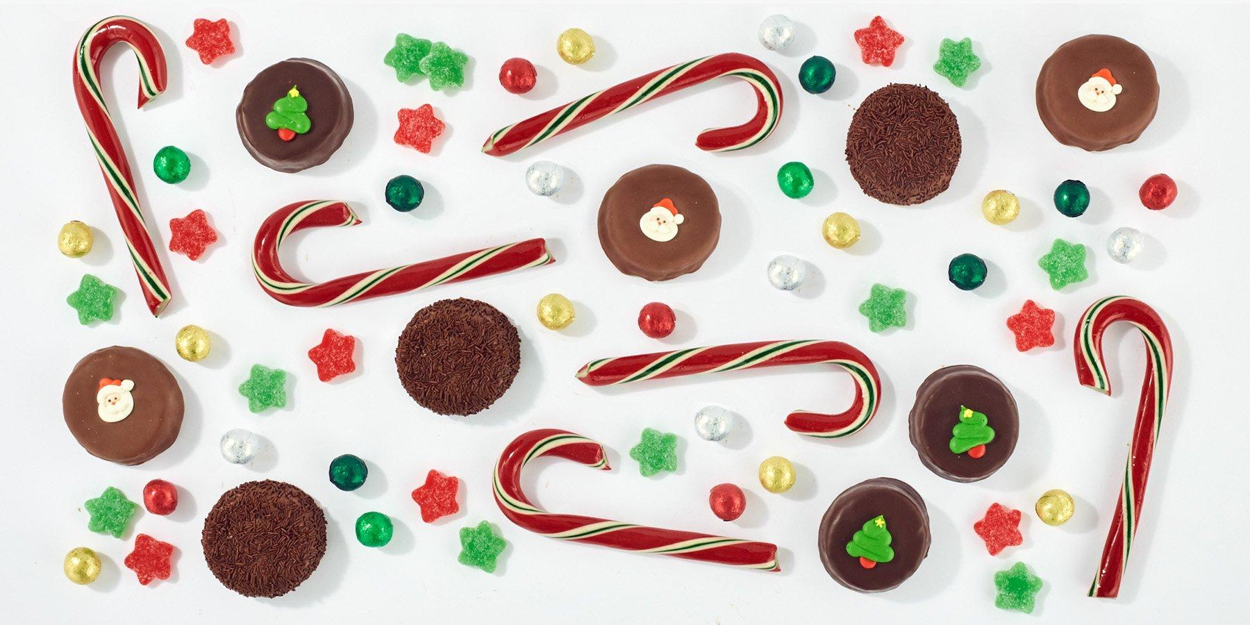 Flat lay of a variety of Gingerbread House candies featuring Peppermint Twists and Milk Chocolate Balls 