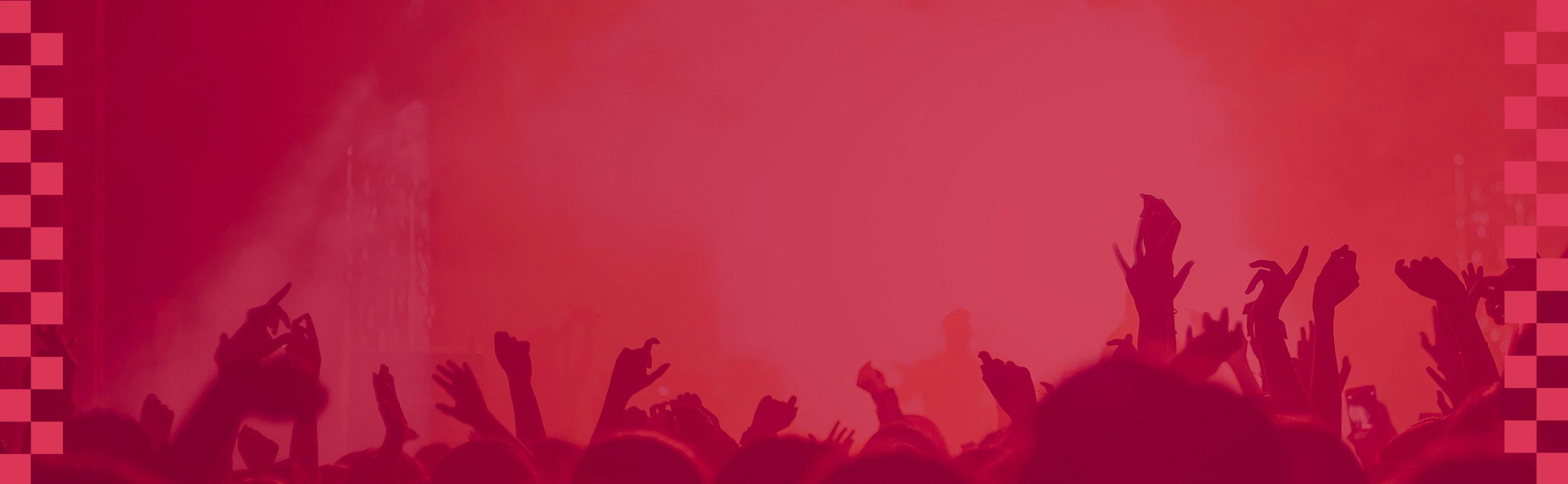 Shadows of a lively crowd with their hands in the air
