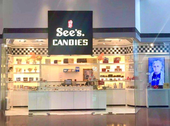 A See's Candies storefront is shown in a mall setting.