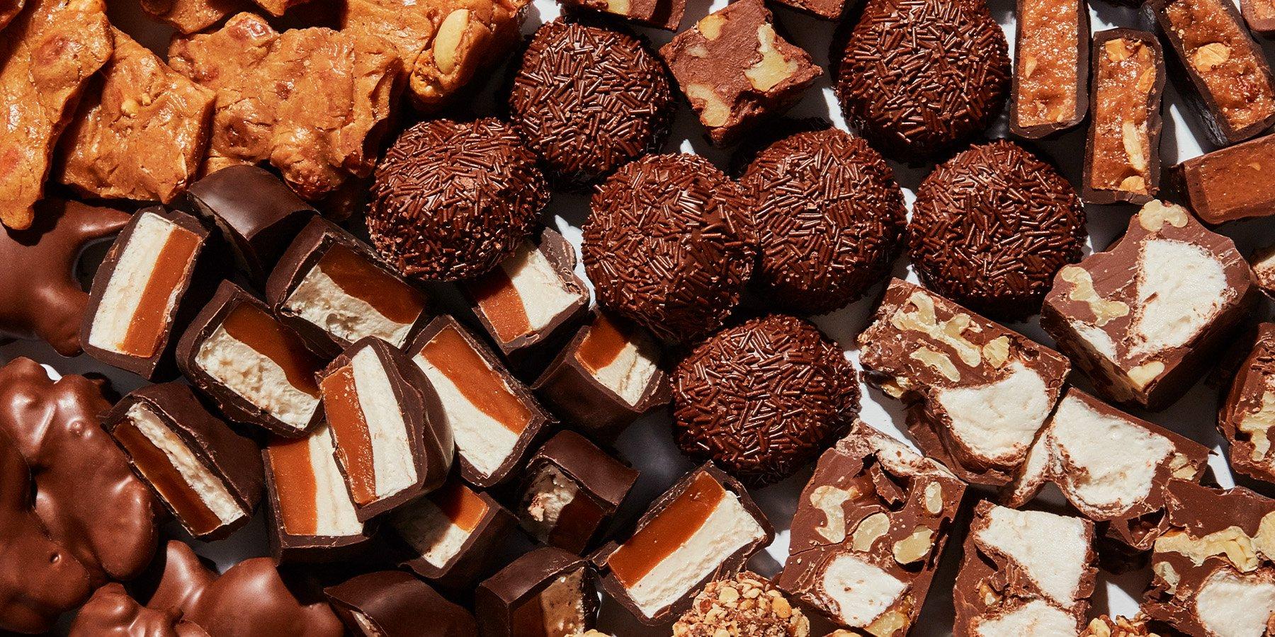 Close up look at a variety of See's Candies featuring Dark Scotchmallow, Milk Bordeaux, and Milk Butterscotch Square.