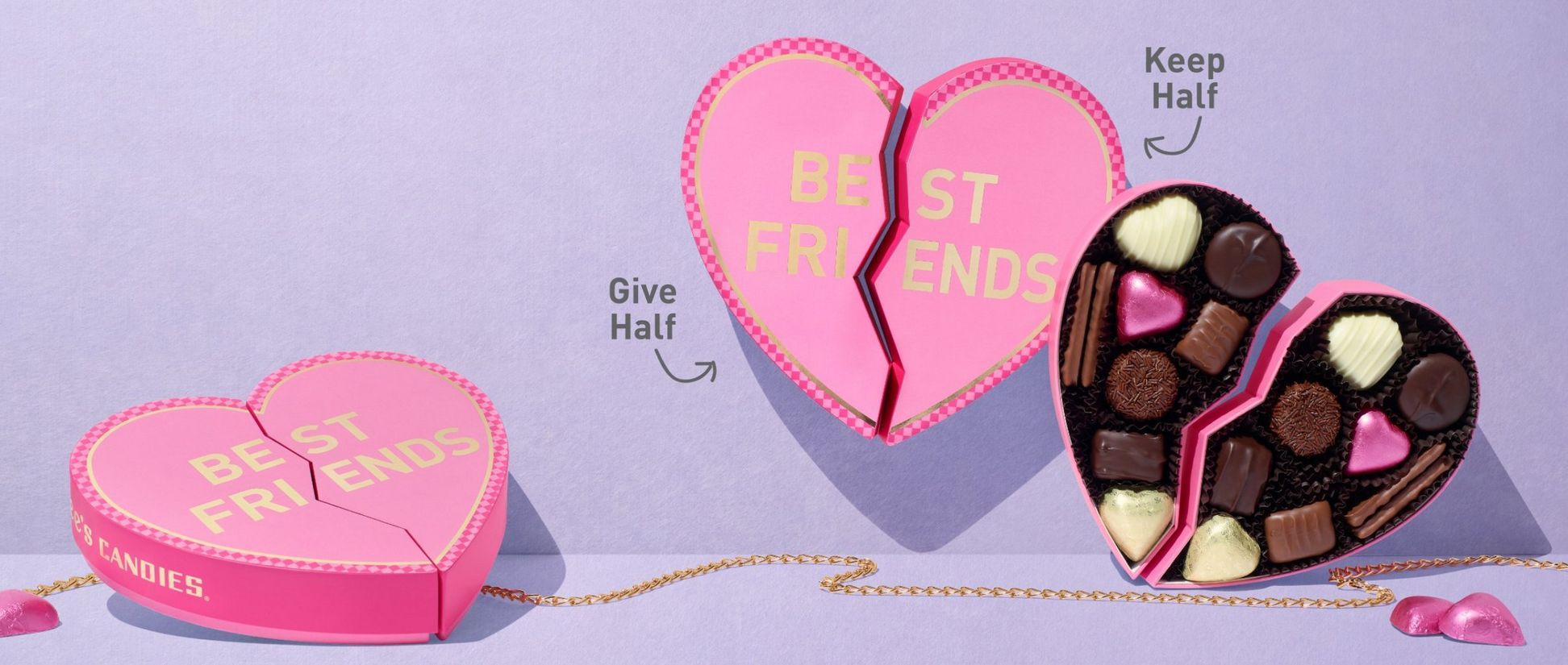 A cracked pink heart filled with chocolates with the words "Best Friends" on it